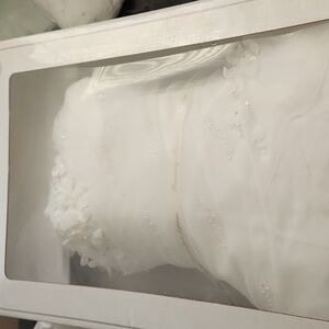 Wedding dress not sure of size as it has been in box since Aug 2012